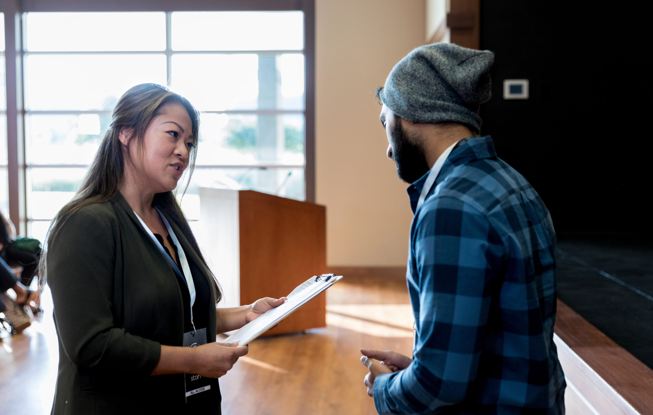 Mid adult conference organizer preps hipster for break out session